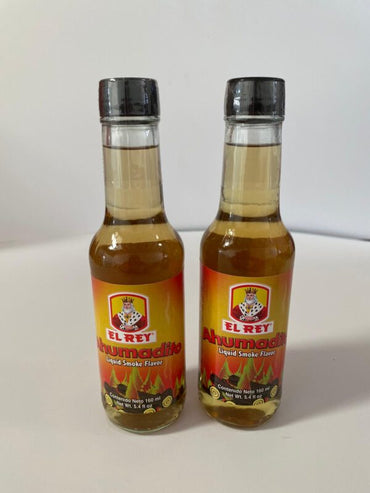 Salsa de humo líquido El Rey utilizada para aportar sabor ahumado a carnes, parrillas y recetas tradicionales.